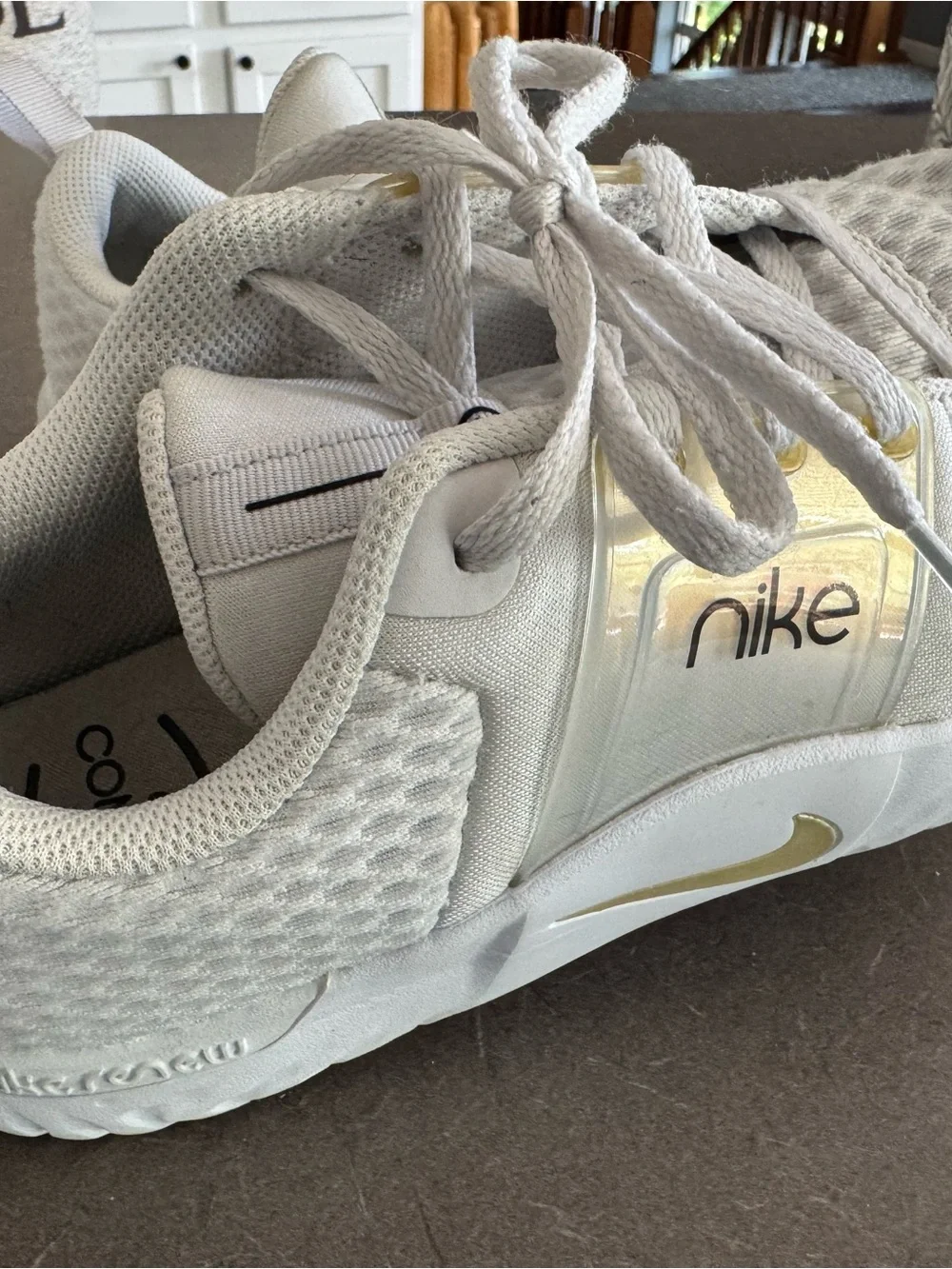 Nike White Sneakers with Gold Accents